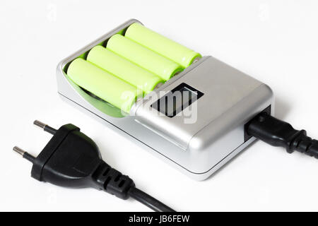 Charger for four batteries on a white background Stock Photo