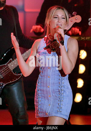 (ATTENTION EDITORS: EMBARGOED UNTIL 10 JULY 2017)     German pop singer Helene Fischer sings during the videotaping of the ZDF anniversary show of '1, 2 oder 3' (lit. 1, 2 or 3) in Cologne, Germany, 08 June 2017. Photo: Oliver Berg/dpa Stock Photo