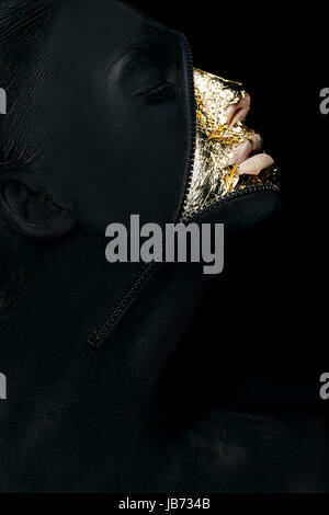 Creative Concept. Surreal Fancy Woman Painted Black with Zip Fastener on her Outlandish Face Stock Photo