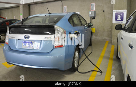 ANN ARBOR, MICHIGAN - JUNE 21: A car being charged at one of the 18 electric vehicle chargers in Ann Arbor on June 21, 2013.  The federally funded chargers have delivered over 10,000 kilowatt hours. Stock Photo