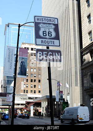 CHICAGO - JULY 19: Sign on Adams Street in Chicago, shown on July 19, 2013, marks the start of the famous Route 66, which goes from Chicago to Los Angeles. Stock Photo