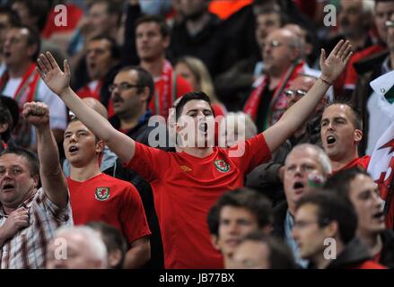 WALES FANS SING IN THE STANDS ENGLAND V WALES WEMBLEY STADIUM LONDON ENGLAND 06 September 2011 Stock Photo