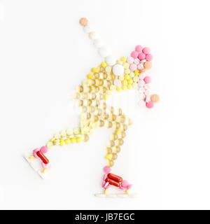 Doping drugs and pills in the shape of a speed ice skater running on ice. Stock Photo