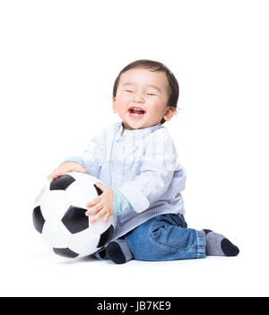 Asiab baby boy feel excited playing soccer ball Stock Photo