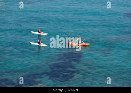 People on a kayak aerial view, people on vacation doing kayak activity on a tranquil blue sea Stock Photo