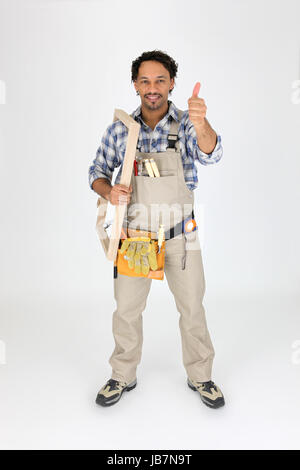 Male woodworker carrying frame Stock Photo