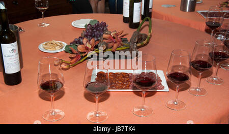 Serving red wine in glasses Stock Photo