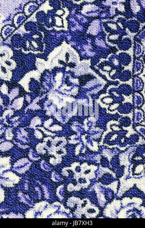Fragment of colorful retro tapestry textile pattern with floral ornament useful as background Stock Photo