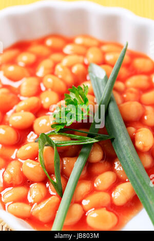 Macro shot of baked beans in a casserole dish Stock Photo