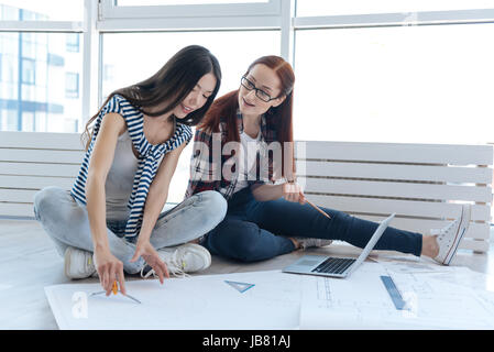 Nice professional engineers working together on a new project Stock Photo