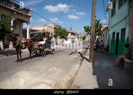 A Cuban man selling fruit and vegetables from his horse and cart in the streets of Cienfuegos Cuba Stock Photo