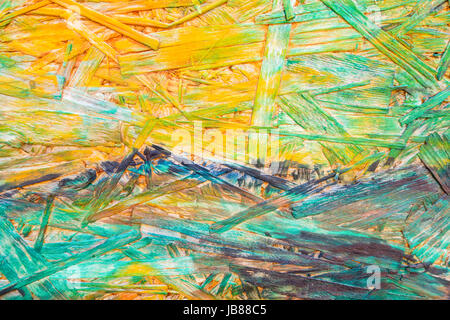 Multicolor painted wood chipboard texture background. Close up Stock Photo