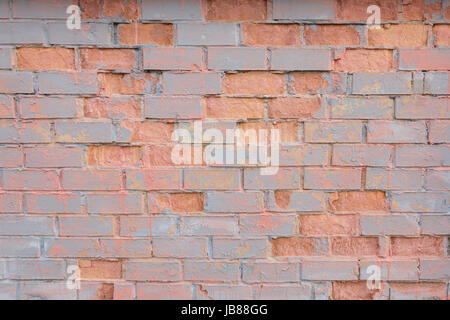 Old vintage painted distressed red brick wall background. Stock Photo