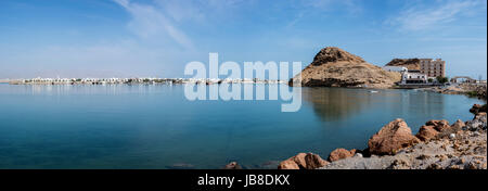 Panoramic view of the Boat Factory and the Khor Al Batah bridge of a part of the city, Sur, Sultanate of Oman, with copy space in the tranquil water Stock Photo