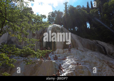 Bagni San Filippo, Italy - June 2 2017: People bathing in Bagni San Filippo natural thermal pools in Tuscany, Italy Stock Photo