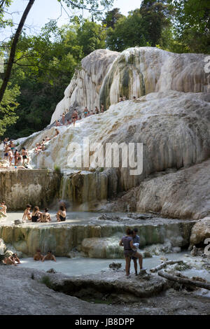 Bagni San Filippo, Italy - June 2 2017: People bathing in Bagni San Filippo natural thermal pools in Tuscany, Italy Stock Photo