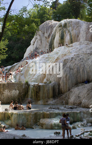 Bagni San Filippo, Italy - June 2 2017: People bathing in Bagni San Filippo natural thermal pools in Tuscany, Italy Stock Photo