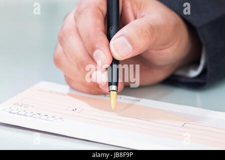 1 Business man Signing Cheque Filling Banking Finance Stock Photo