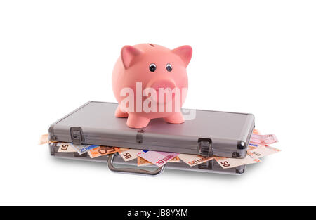 Unique pink ceramic piggy bank on top of metal case filled with money Stock Photo