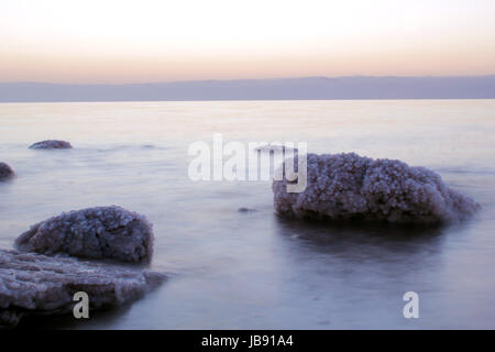 Dead Sea coastline, whit salt crystals and formations in the rocks. Jordan Stock Photo