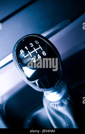 Interior of car, vehicle with visible lever of manual  transmission, with metal, chrome elements. Stock Photo