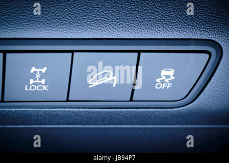 Vehicle, car interior - fragment of panel overview, all wheels, four-wheel, 4WD drive buttons and other safety systems switching buttons. Stock Photo