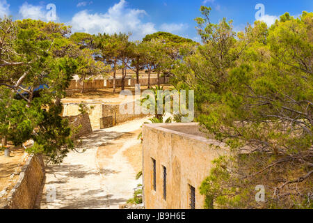 Inner courtyard & fortifications, surrounded by stone walls, Fortezza Castle - Venetian fortress with Bastion defense system on hill Paleokastro in re Stock Photo