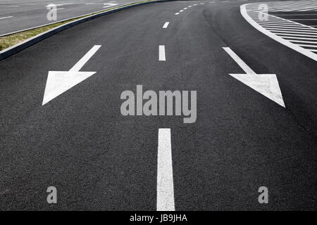 Arrow signs as road markings on a street Stock Photo