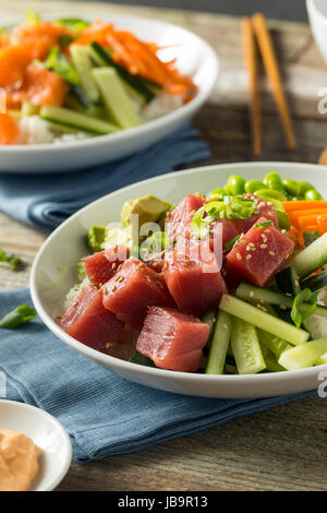 Raw Organic Ahi Tuna Poke Bowl with Rice and Veggies Stock Photo