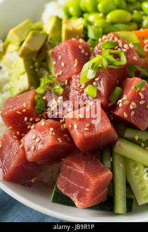 Raw Organic Ahi Tuna Poke Bowl with Rice and Veggies Stock Photo