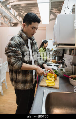 Couple working in kitchen at home Stock Photo