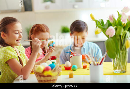Preschoolers decorating Easter eggs Stock Photo