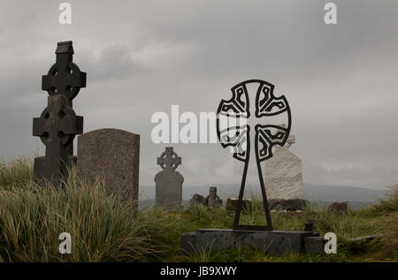 Celtic cross headstones in the cemetery of St. Caomhan's Church on Inisheer, Ireland. Stock Photo