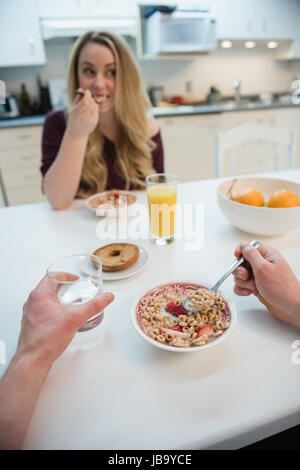 Couple having healthy breakfast in kitchen at home Stock Photo