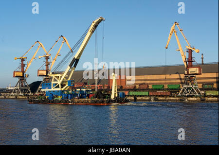 Gantries in the waters of the port of Ventspils Stock Photo