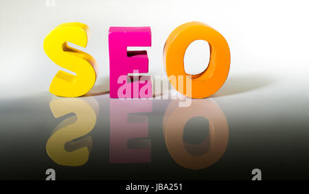 Multicolored text seo made of wood. White background Stock Photo