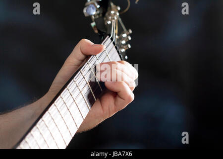 Man playing les paul electric guitar is studio Stock Photo