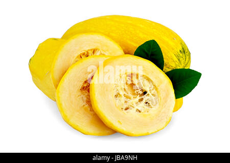 Ripe yellow zucchini cut into pieces with two green leaves of lemon isolated on a white background Stock Photo