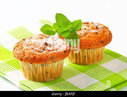Studio shot of two chocolate chip muffins Stock Photo