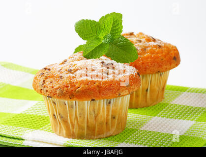 Studio shot of two chocolate chip muffins Stock Photo