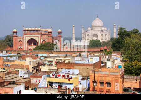 Rooftops of Taj Ganj neighborhood and Taj Mahal in Agra, India. Taj Mahal was build in 1632 by Emperor Shah Jahan as a memorial for his second wife Mu Stock Photo