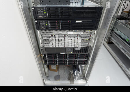 servers stack with hard drives in a datacenter for backup and data storage Stock Photo