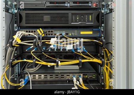 fiber optic data center with media converters and optical cables Stock Photo