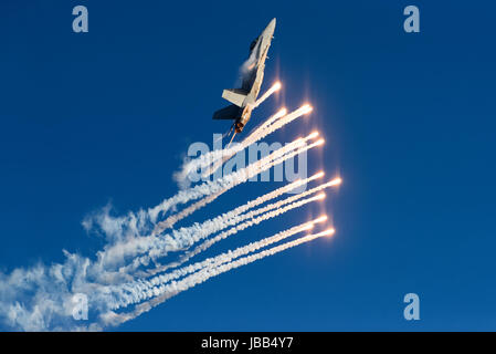 Helsinki, Finland - 9 June 2017: Finnish Air Force Hornet F/A-18  shooting out flares at the Kaivopuisto Air Show in Helsinki, Finland on 9 June 2017. Stock Photo