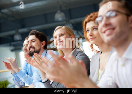 Photo of happy business partners applauding at conference Stock Photo