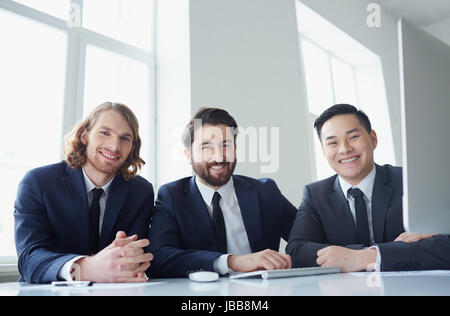 Portrait of three successful entrepreneurs looking at camera Stock Photo