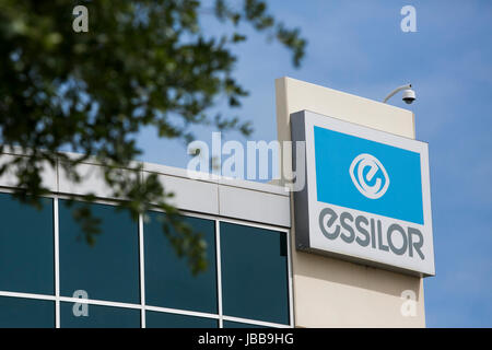 A logo sign outside of the headquarters of Essilor of America in Dallas, Texas, on May 29, 2017. Stock Photo