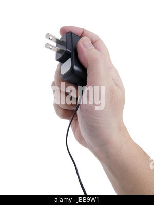 hand holding a power source ready to connect the outlet. Stock Photo