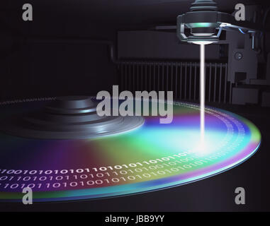 The laser writes information to disk (CD, DVD, Blu-Ray). Concept of technology and future. Stock Photo