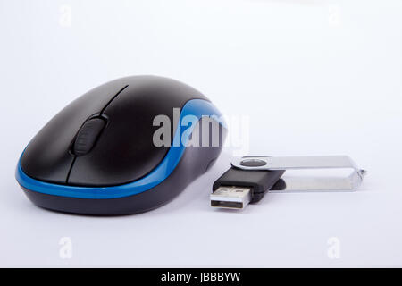 Pure white background with computer mouse and usb stick Stock Photo
